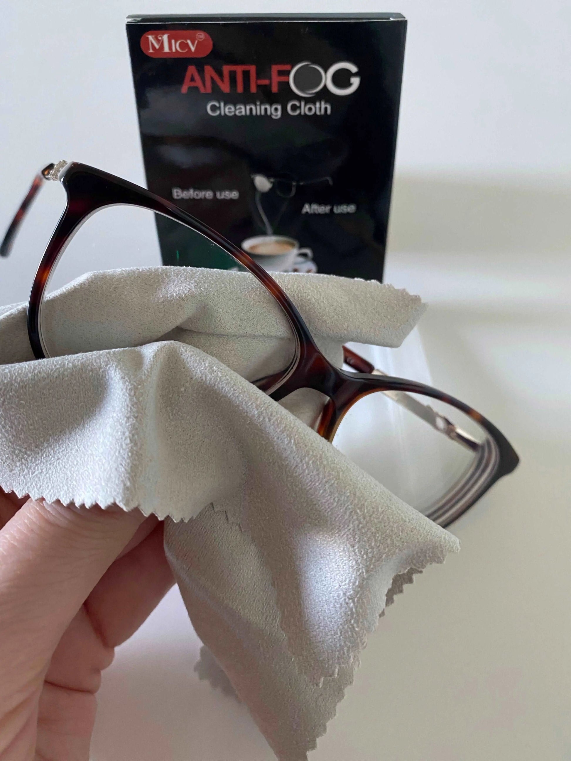 Cleaning glasses with anti fog cloth